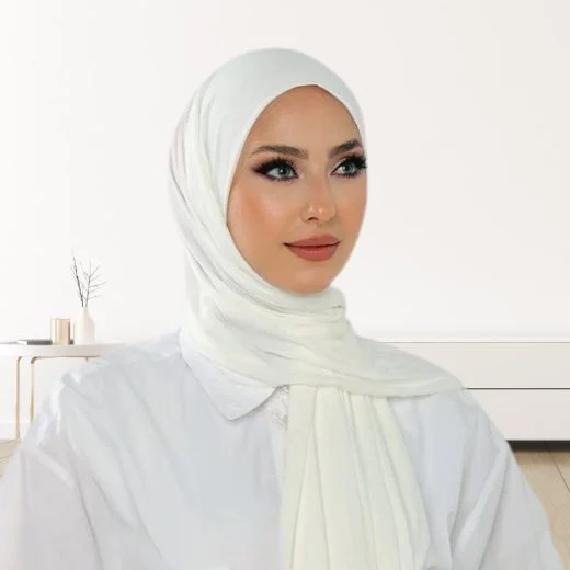 A woman wearing a draped jersey hijab. Clothifydotpk