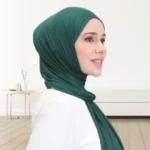 A woman wearing a draped jersey hijab. Clothifydotpk