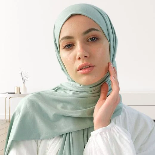 A woman wearing a draped jersey hijab. Clothifydotpk