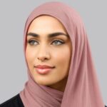 A woman comfortably wearing a modal hijab, highlighting the fabric's fluid drape. Clothifydotpk