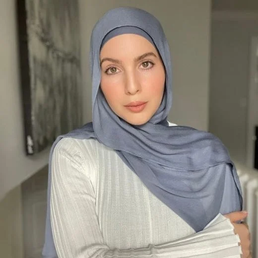 Modal_0192 - 23 A woman comfortably wearing a modal hijab, highlighting the fabric's fluid drape. Clothifydotpk