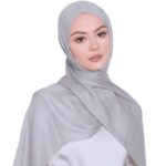 A woman comfortably wearing a modal hijab, highlighting the fabric's fluid drape. Clothifydotpk