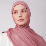 A woman comfortably wearing a modal hijab, highlighting the fabric's fluid drape. Clothifydotpk