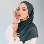 A woman comfortably wearing a modal hijab, highlighting the fabric's fluid drape. Clothifydotpk