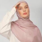 A woman comfortably wearing a modal hijab, highlighting the fabric's fluid drape. Clothifydotpk