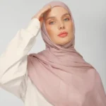 A woman comfortably wearing a modal hijab, highlighting the fabric's fluid drape. Clothifydotpk