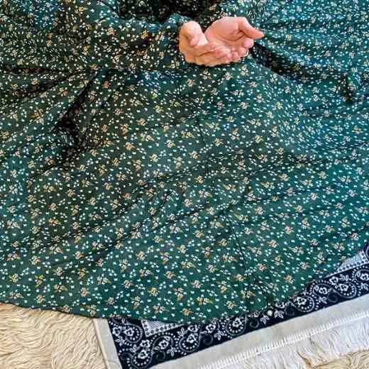 NC_Pocket_5731 - 11 A woman wearing a printed full-length namaz chadar with Sleeves, showcasing its loose, flowy fit and long sleeves for complete coverage during Namaz. Clothifydotpk