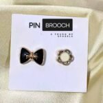 Close-up of an elegant pin brooch, used to stylishly secure a hijab. Clothifydotypk