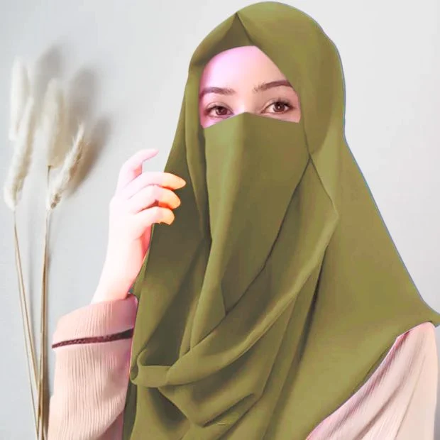 A woman wearing a simply draped Misri hijab, with the ends flowing over her shoulder. Clothifydotpk