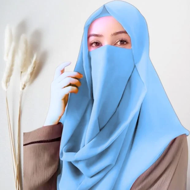A woman wearing a simply draped Misri hijab, with the ends flowing over her shoulder. Clothifydotpk