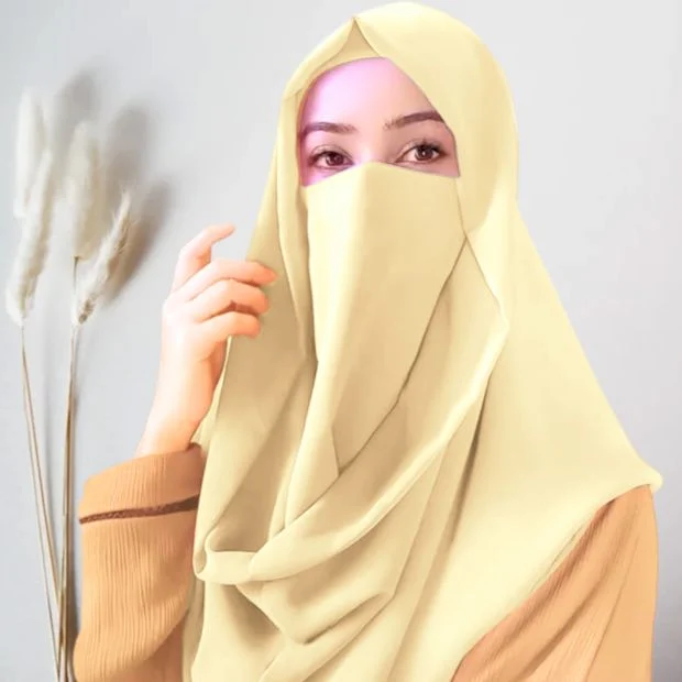 A woman wearing a simply draped Misri hijab, with the ends flowing over her shoulder. Clothifydotpk