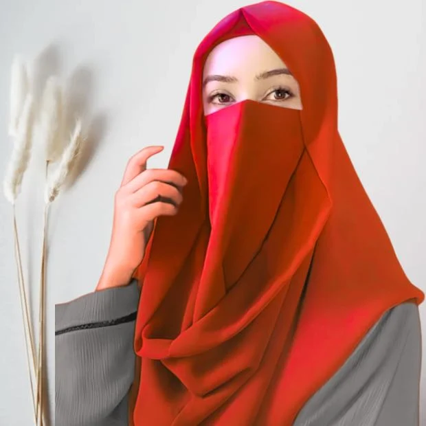 A woman wearing a simply draped Misri hijab, with the ends flowing over her shoulder. Clothifydotpk