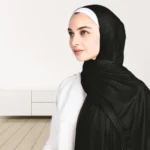A woman wearing a draped ribbed jersey hijab. Clothifydotpk