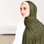 A woman wearing a draped ribbed jersey hijab. Clothifydotpk