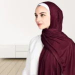 A woman wearing a draped ribbed jersey hijab. Clothifydotpk