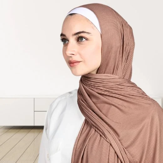 A woman wearing a draped ribbed jersey hijab. Clothifydotpk