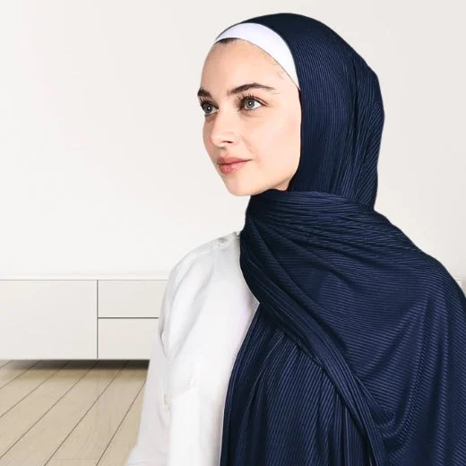 A woman wearing a draped ribbed jersey hijab. Clothifydotpk