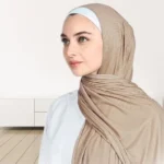 A woman wearing a draped ribbed jersey hijab. Clothifydotpk