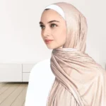 A woman wearing a draped ribbed jersey hijab. Clothifydotpk