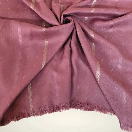 Detail shot of a self zari hijab, showing how the metallic zari threads are woven directly into the fabric to create a shimmering, textured pattern without heavy embroidery. Clothifydotpk