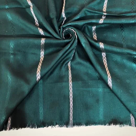 Detail shot of a self zari hijab, showing how the metallic zari threads are woven directly into the fabric to create a shimmering, textured pattern without heavy embroidery. Clothifydotpk