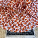 A woman using a Winter Namaz Chadar, performing namaz. Clothifydotpk
