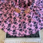 A woman using a Winter Namaz Chadar, performing namaz. Clothifydotpk