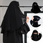 A woman wearing a premium black three layer niqab. By Clothifydotpk