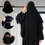 A woman wearing a premium black three layer niqab. By Clothifydotpk