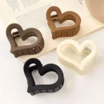 The sleek, ergonomic design of the heart shape matte finish hair claw clips Clothifydotpk
