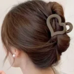 The sleek, ergonomic design of the heart shape matte finish hair claw clips Clothifydotpk