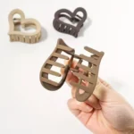 The sleek, ergonomic design of the heart shape matte finish hair claw clips Clothifydotpk
