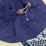 A young kid wearing a Namaz Chadar, made from breathable fabric. By Clothifydotpk