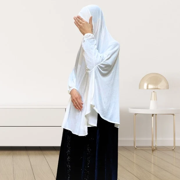 A woman wearing a jersey makhna hijab, providing full coverage for the head, neck, and shoulders without pins. CLOTHIFYDOTPK