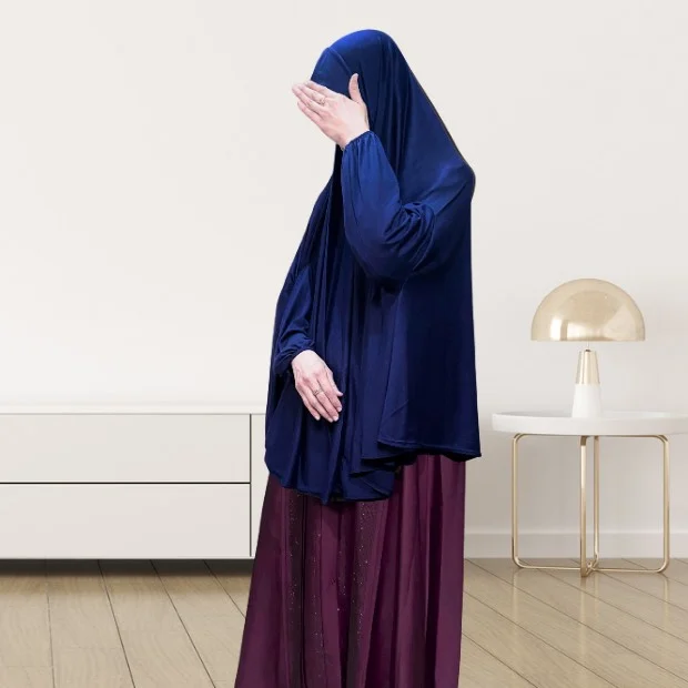 Sleeves Makhna_846 - 19 A woman wearing a jersey makhna hijab, providing full coverage for the head, neck, and shoulders without pins. CLOTHIFYDOTPK