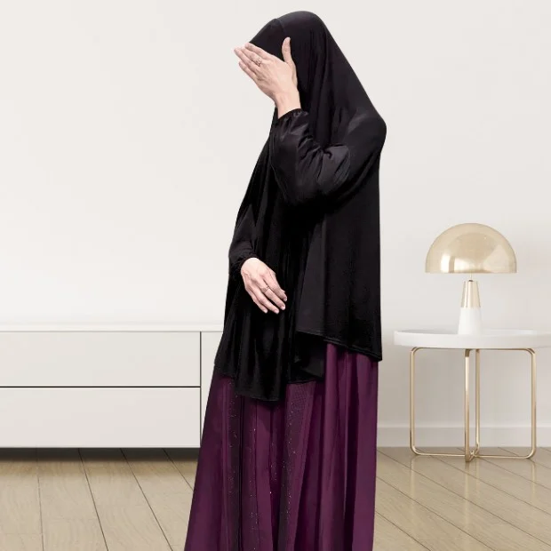 A woman wearing a jersey makhna hijab, providing full coverage for the head, neck, and shoulders without pins. CLOTHIFYDOTPK