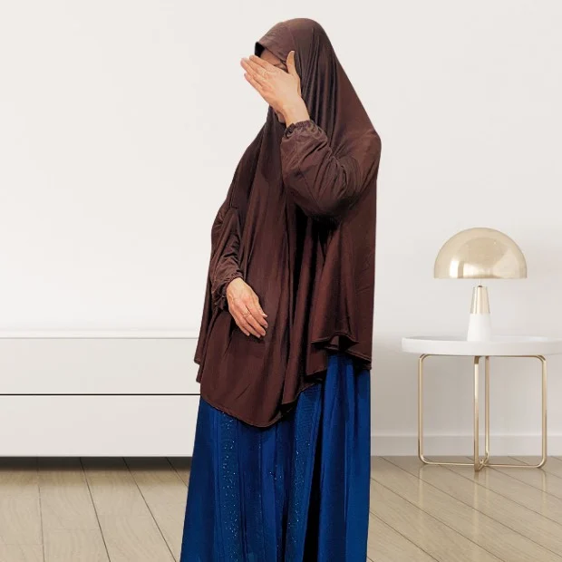 Sleeves Makhna_846 - 21 A woman wearing a jersey makhna hijab, providing full coverage for the head, neck, and shoulders without pins. CLOTHIFYDOTPK