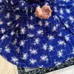 A woman using a Winter Namaz Chadar, performing namaz By Clothifydotpk