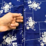 A woman using a Winter Namaz Chadar, performing namaz By Clothifydotpk