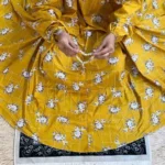 A woman using a Winter Namaz Chadar, performing namaz By Clothifydotpk