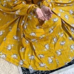 A woman using a Winter Namaz Chadar, performing namaz By Clothifydotpk