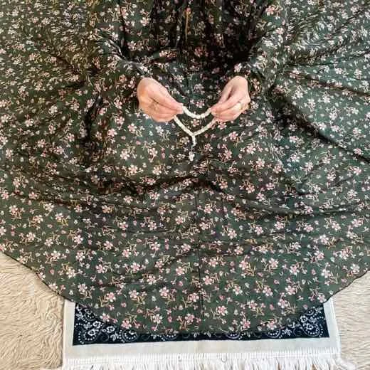 NamazChadar_3Dec25 - 6 A woman using a breathable soft swiss lawn Namaz Chadar with Sleeves, performing salah By Clothifydotpk