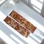 A pair of imported arm sleeves with a printed design.