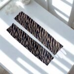 A pair of imported arm sleeves with a printed design.