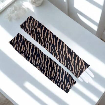 A pair of imported arm sleeves with a printed design.