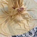 a kid with plain namaz chadar with sleeves offering salah. By Clothifydotpk