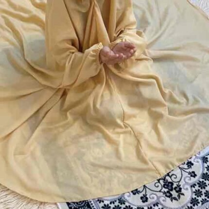 a kid with plain namaz chadar with sleeves offering salah. By Clothifydotpk