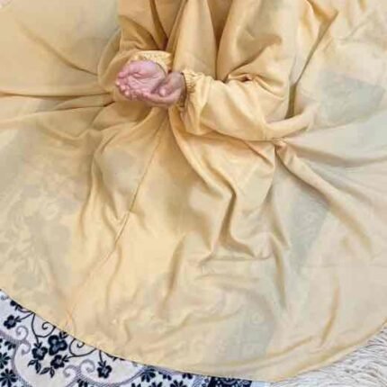 a kid with plain namaz chadar with sleeves offering salah. By Clothifydotpk