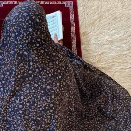 A woman's namaz chadar without sleeves.