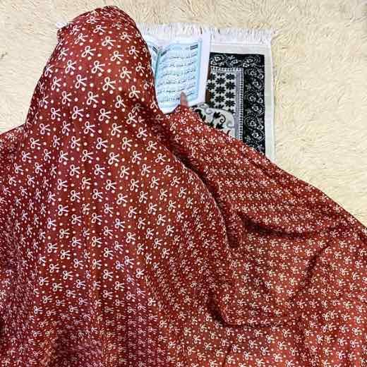 A woman's large size namaz chadar without sleeves.